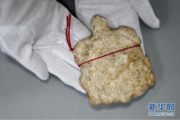 Un des artefacts récupérés. [Photo / xinhuanet.com.cn]