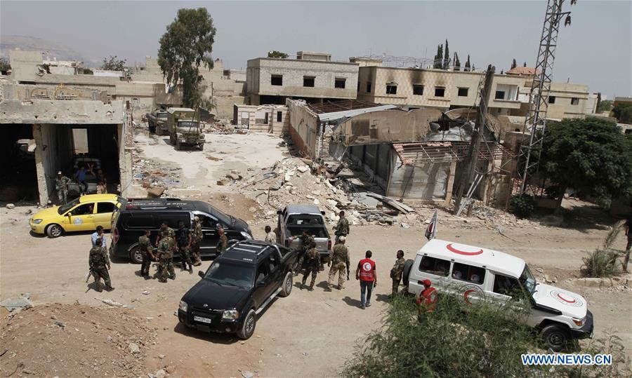 Les premiers Syriens commencent à évacuer la ville assiégée de Daraya