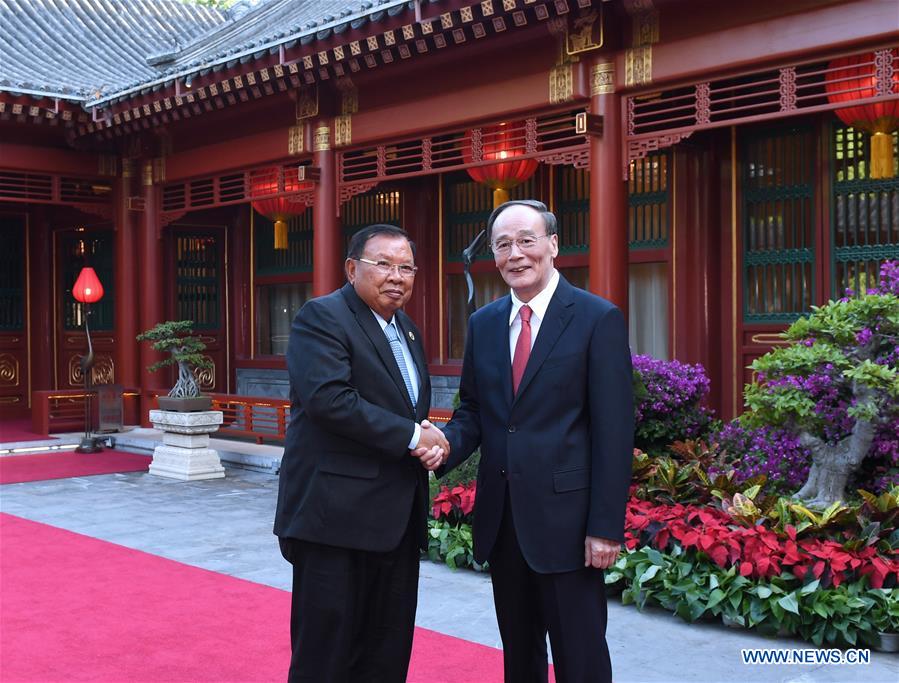 Le PCC et le PRPL approfondiront les échanges sur la construction du parti, selon Wang Qishan