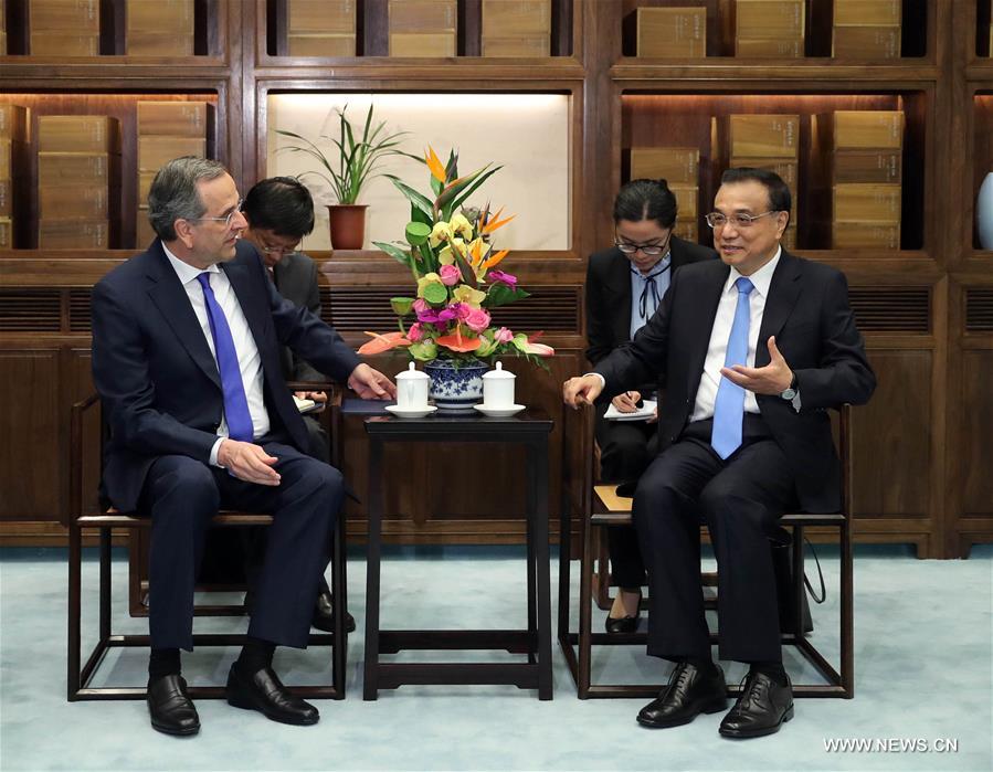 Le Premier ministre chinois rencontre un ancien Premier ministre grec