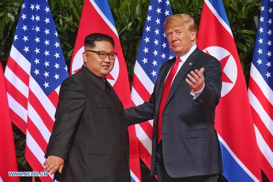 Poignée de main Kim-Trump avant le sommet historique