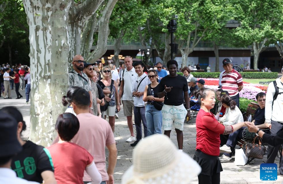 Histoire en photos d'un planificateur de tourisme entrant qui révèle aux visiteurs étrangers le véritable Shanghai